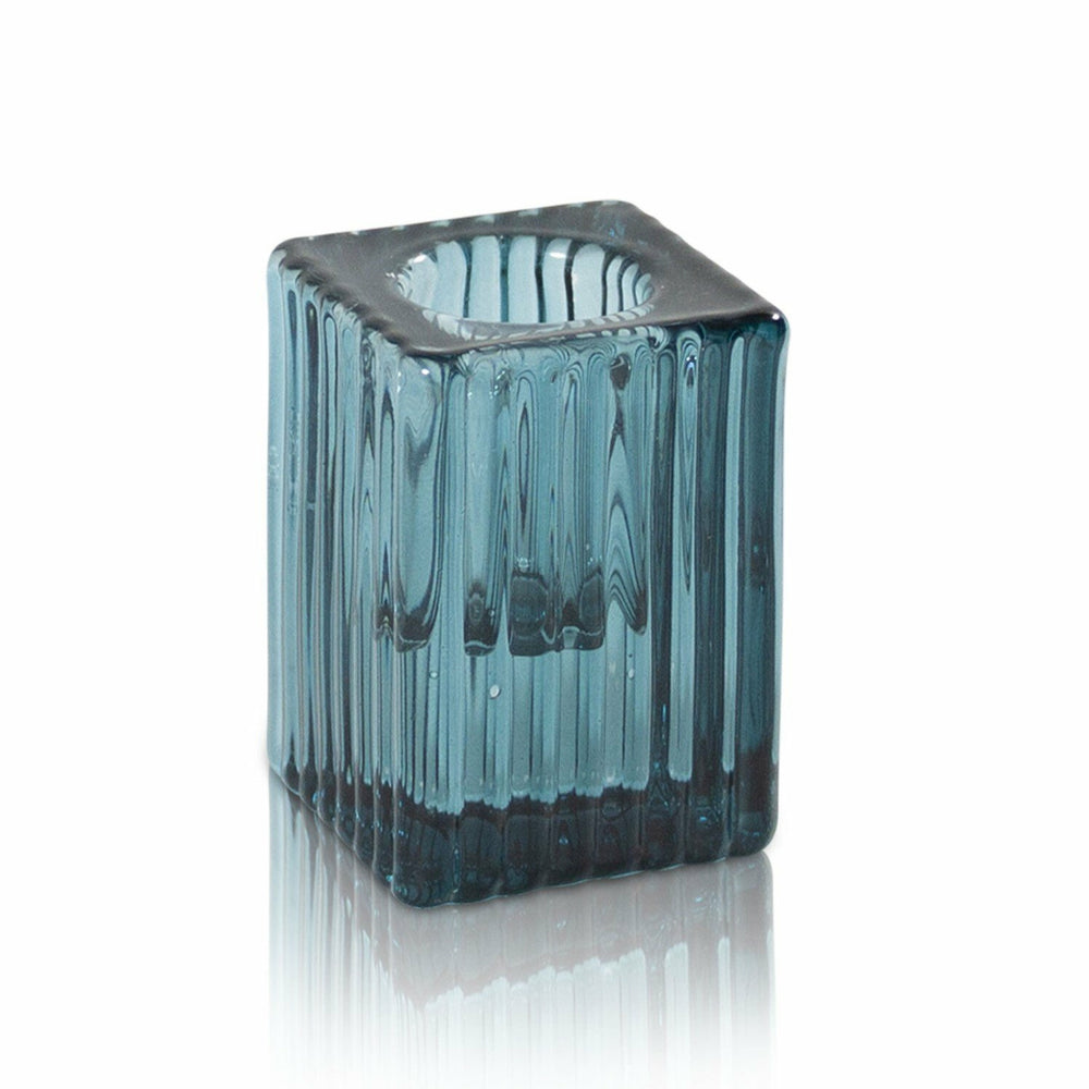 Enzo Vintage Glass Candle Holder in Ocean features elegantly pleated glass in a classic cube shape. Designed to fit both our Dinner and Taper candles