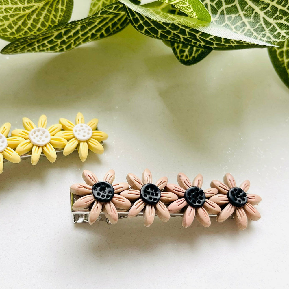 
                  
                    FLOWER HAIR CLIP BY SANDS & RILES
                  
                