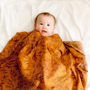 
                  
                    RUST EUCALYPTUS ORGANIC MUSLIN WRAP SWADDLE BY FOX & FALLOW
                  
                